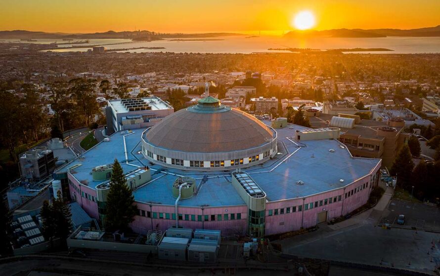 The Advanced Light Source dome as seen from an aerial drone at sunset looking towards the San Francisco Bay and Golden Gate Bridge.